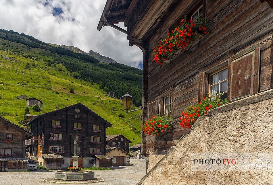 Traditional wooden buildings in Vals village and in the background the old square, Grisons, Switzerland, Europe