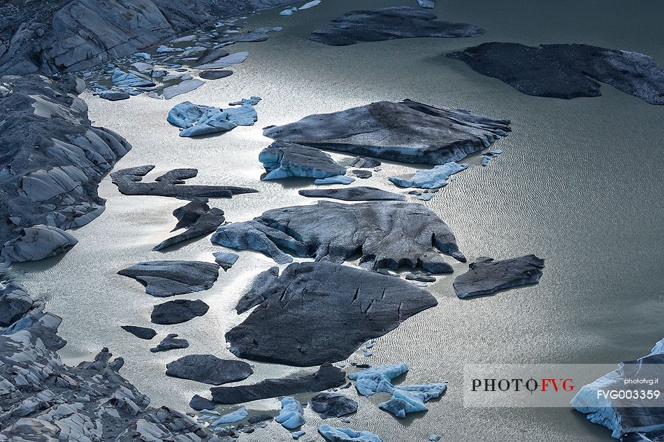 Iceberg on the little fusion lake on Rhone Glacier at Furka Pass, Canton of Valais, Switzerland, Europe