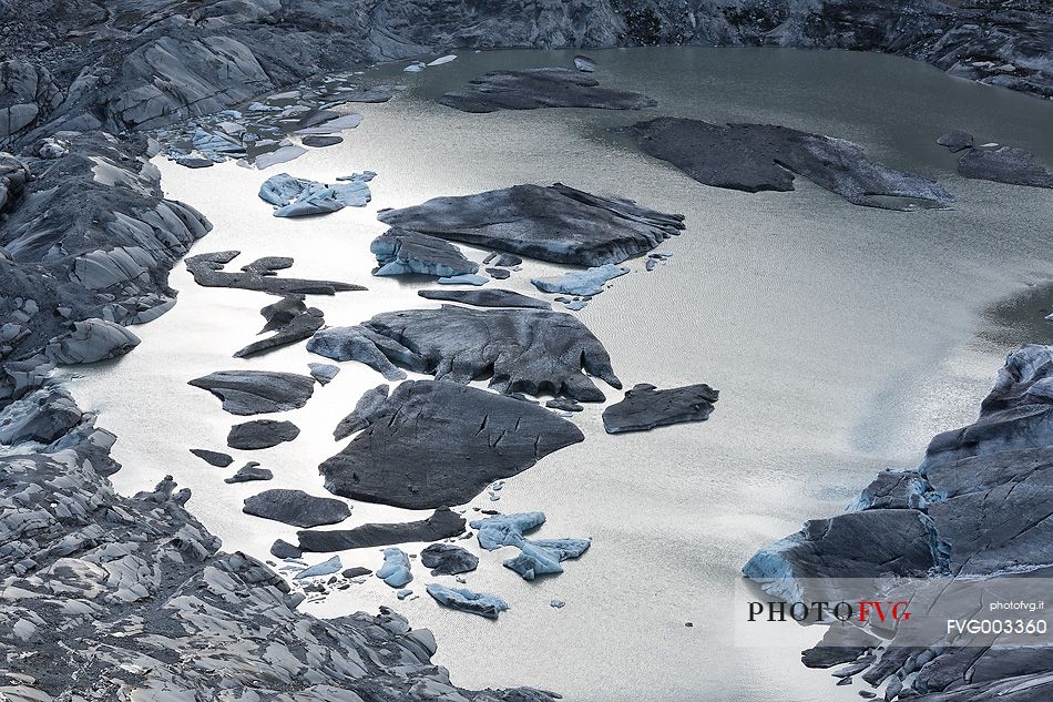 Iceberg on the little fusion lake on Rhone Glacier at Furka Pass, Canton of Valais, Switzerland, Europe