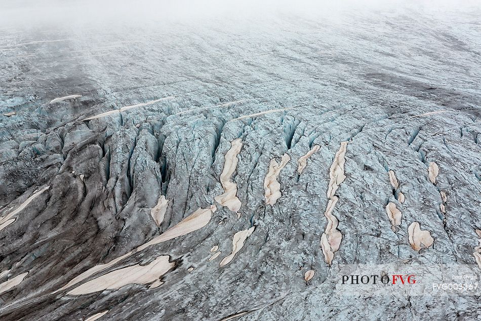 Mist and fog on Rhone Glacier at dawn, Furka pass, Valais, Switzerland, Europe