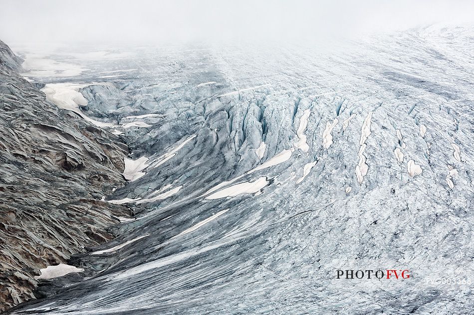 Mist and fog on Rhone Glacier at dawn, Furka pass, Valais, Switzerland, Europe