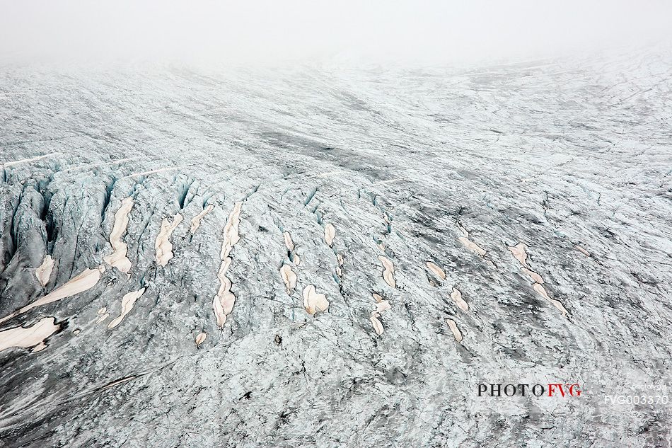 Mist and fog on Rhone Glacier at dawn, Furka pass, Valais, Switzerland, Europe