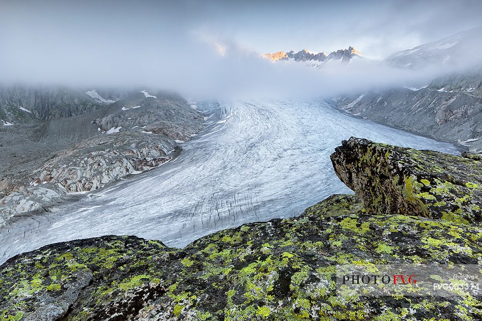 Rhone glacier in the mist of a clear morning dawn, Furka pass, Valais, Switzerland, Europe