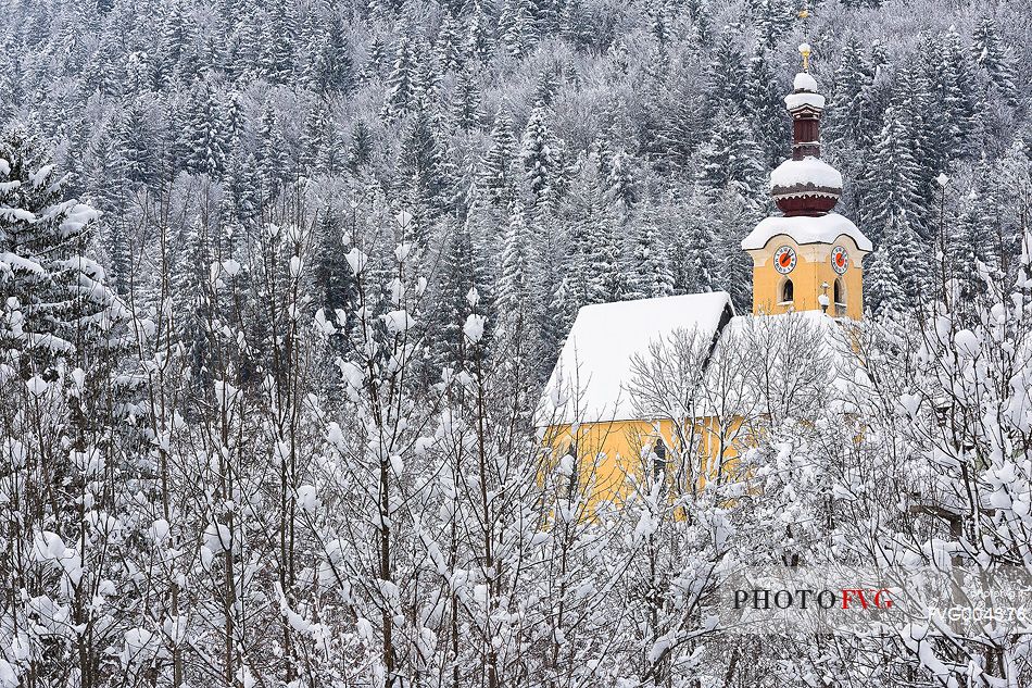 Alpine church in Fusine near the border with Austria and Slovenia after an heavy snowfall