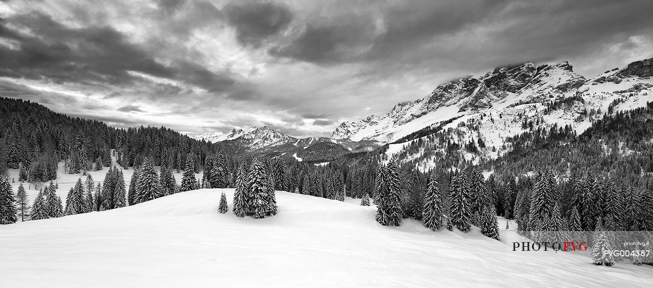 Zoldana Valley and Civetta Mountain group at dawn after a night snowfall