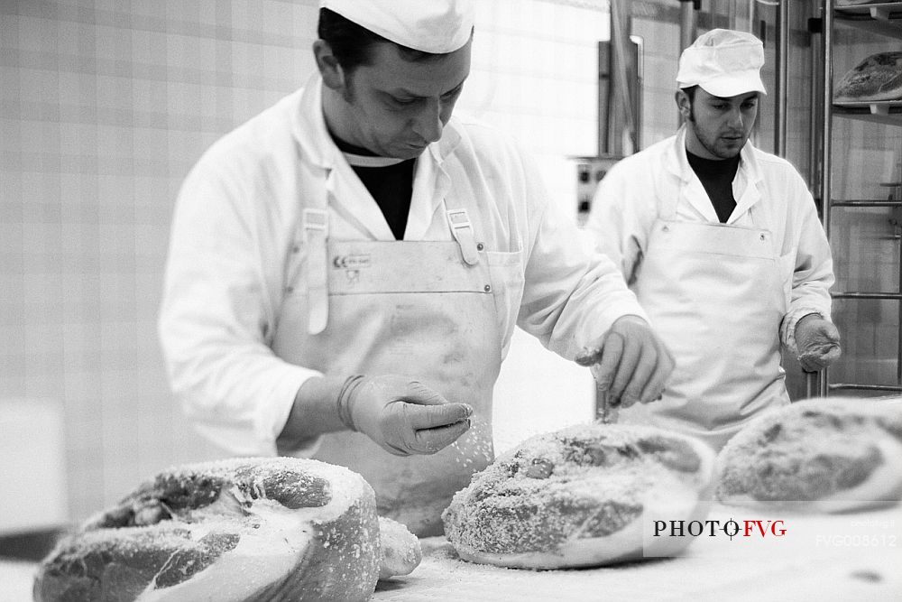 Processing hams in Wolf ham factory of Sauris