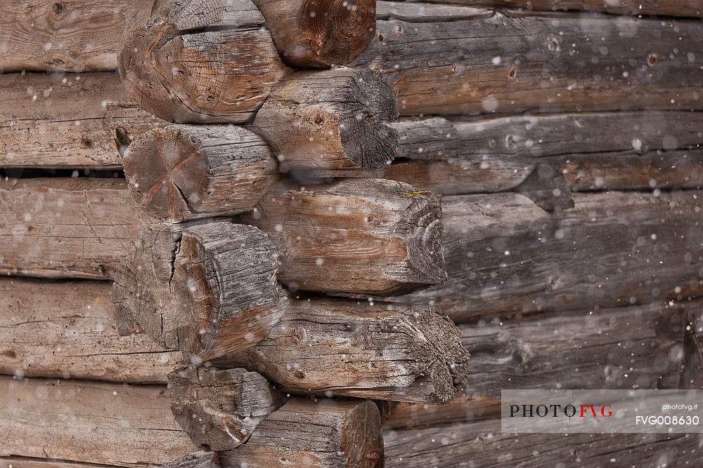 Closeup of corner of a typical wooden building in alpine village of Sauris di Sotto