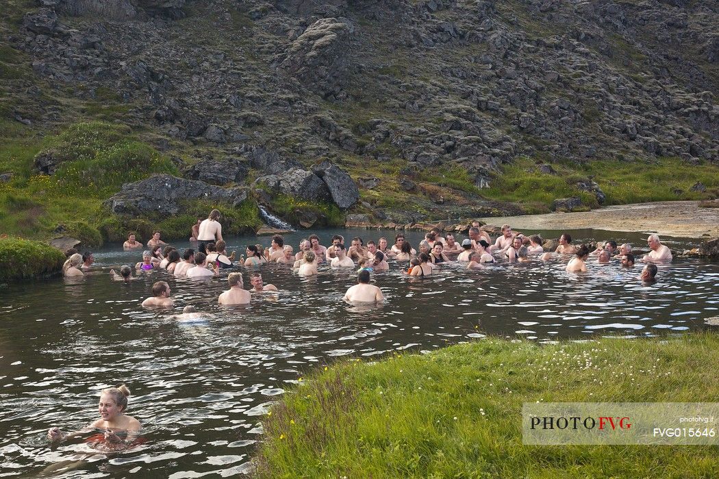 Group of people doing bath in one of the amazing natural thermal pool in Landmannalaugar Area
