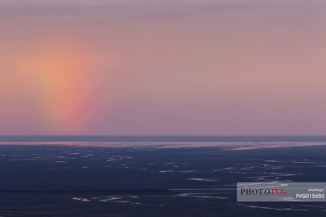 Rainbow over the desertic landscape of South Iceland from the mountain area of Skftafell