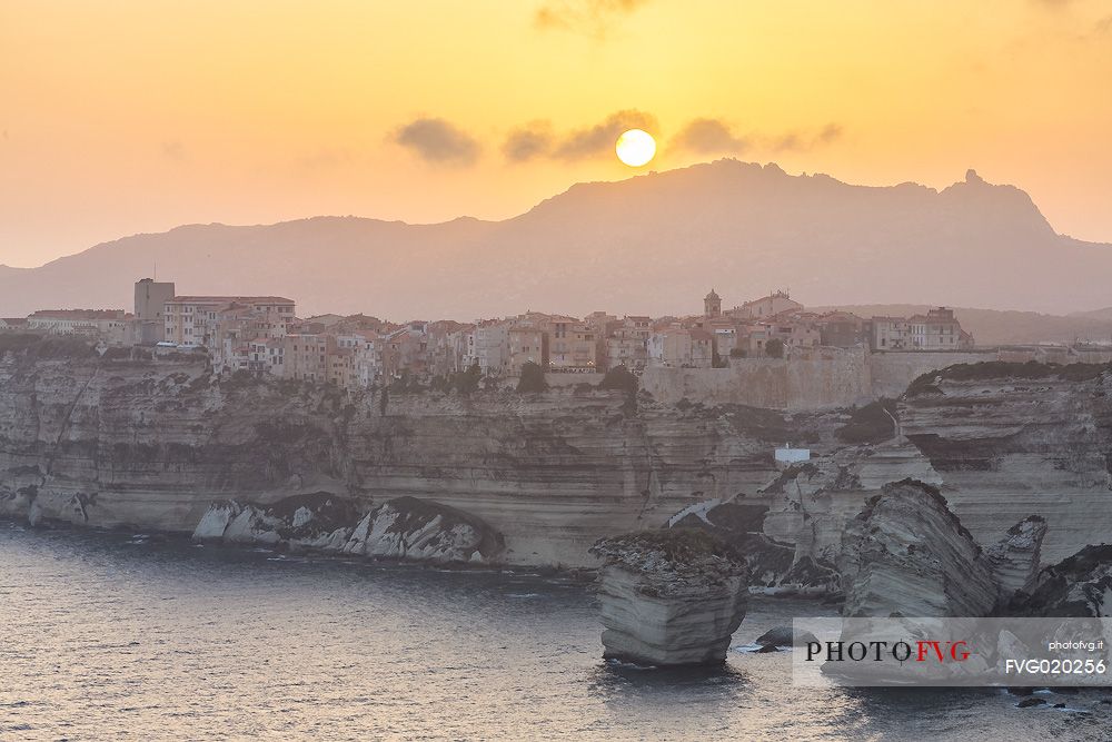 White cliffs and the old village of Bonifacio at sunset, Corsica