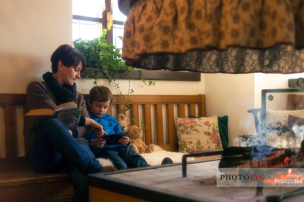 Mother and son in Meuble Pa'Krhaizar, one of the most beautiful and characteristic house of Sauris village, Lateis