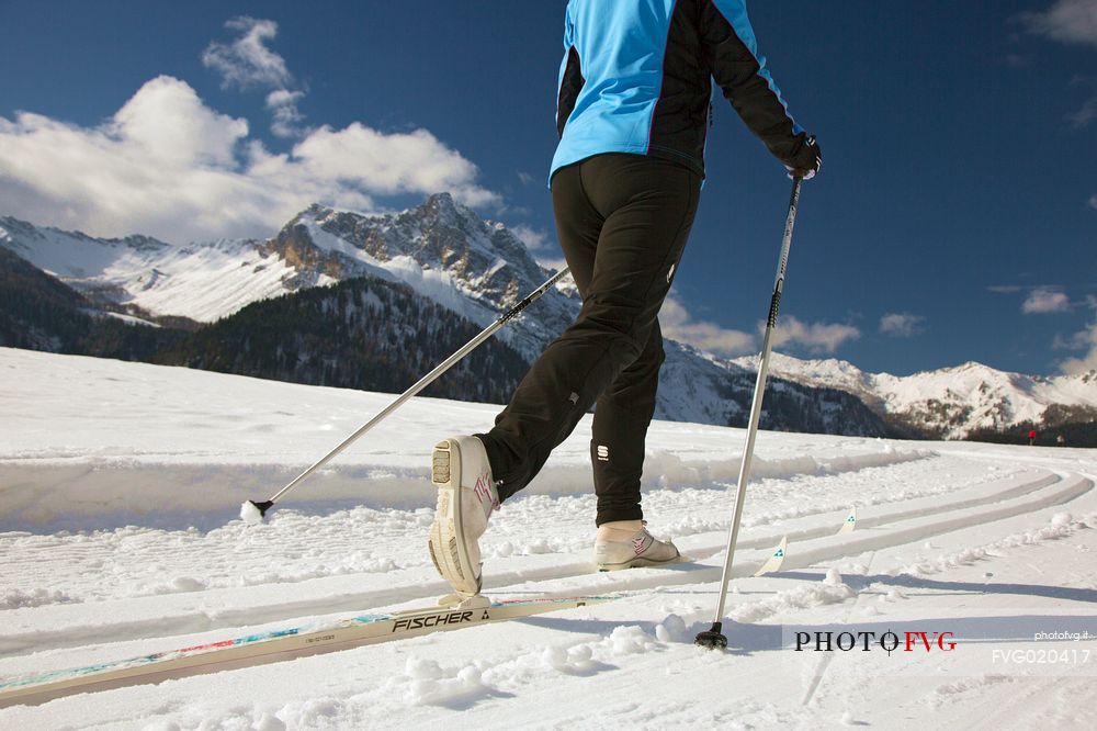 Cross-country skiing on the slopes of Sauris di Sopra , in the background the Monte Bivera , Sauris