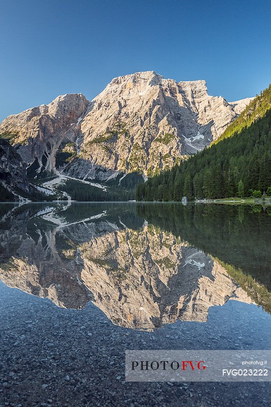 Braies Lake (Pragser Wildsee) with first light morning on Croda del Becco mountain (Seekofel), Dolomites, South Tyrol, Italy 