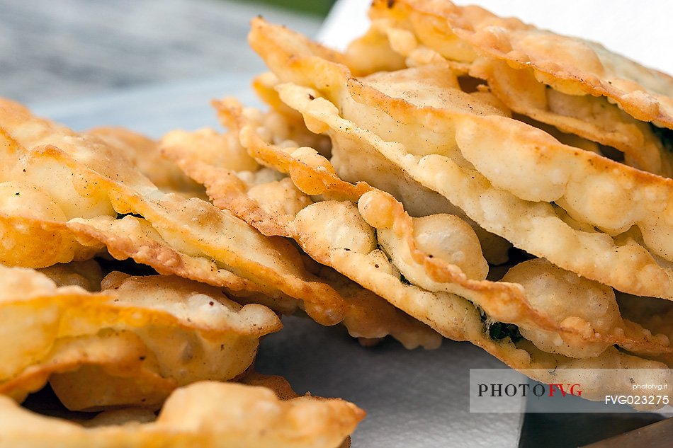 Turtres (pancakes stuffed with cheese and spinach), traditional ladin food, South Tyrol, Dolomites, Italy 