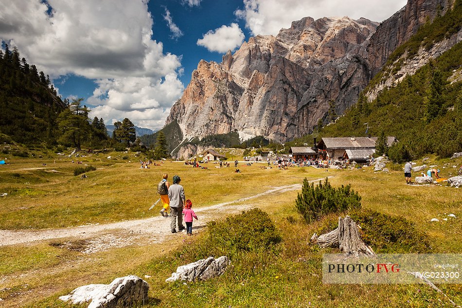 Tourists walking along the path of Scotoni hut, Badia Valley,South Tyrol, Dolomites, Italy 