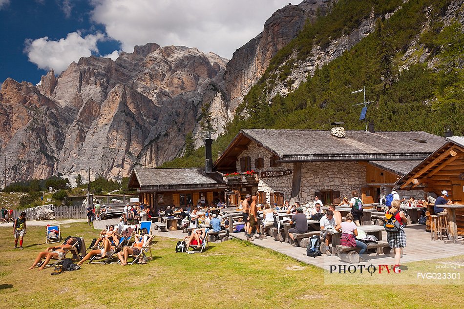 Tourists and hikers are resting at Scotoni hut, Badia Valley,South Tyrol, Dolomites, Italy 
