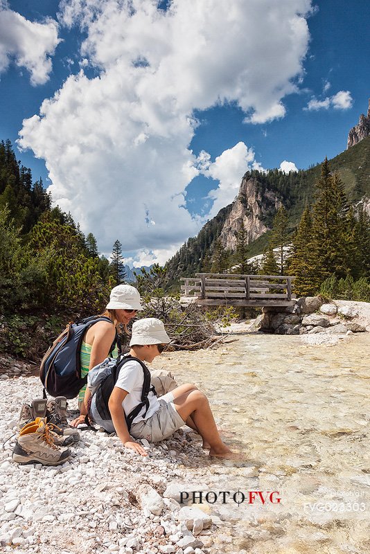 Enjoying with water of a stream, Badia Valley, South Tyrol, Dolomites, Italy 