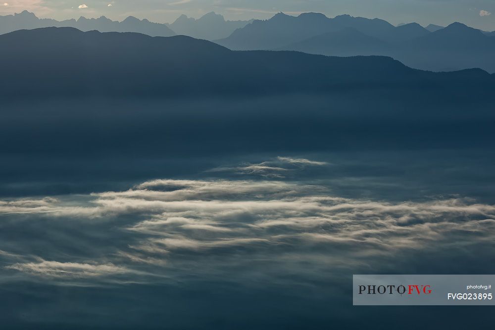Sunrise on the Non Valley (Val di Non) in the clouds, Brenta dolomites, Italy
