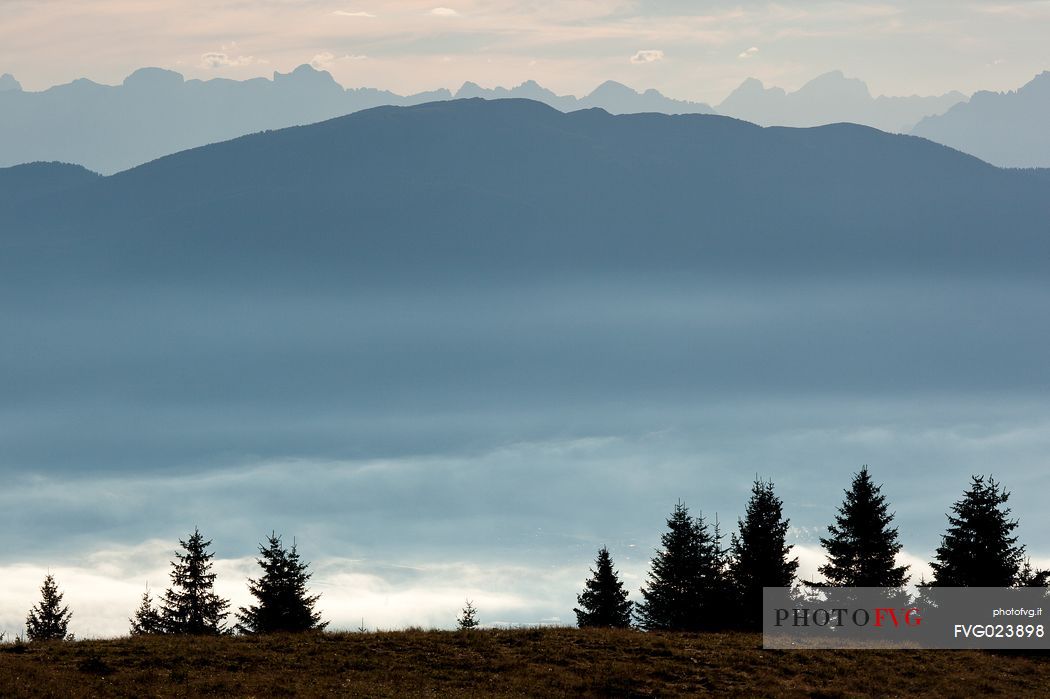 Sunrise on the Val di Non Valley shrouded in mist from the Peller hut, Cles, Brenta dolomites, Italy