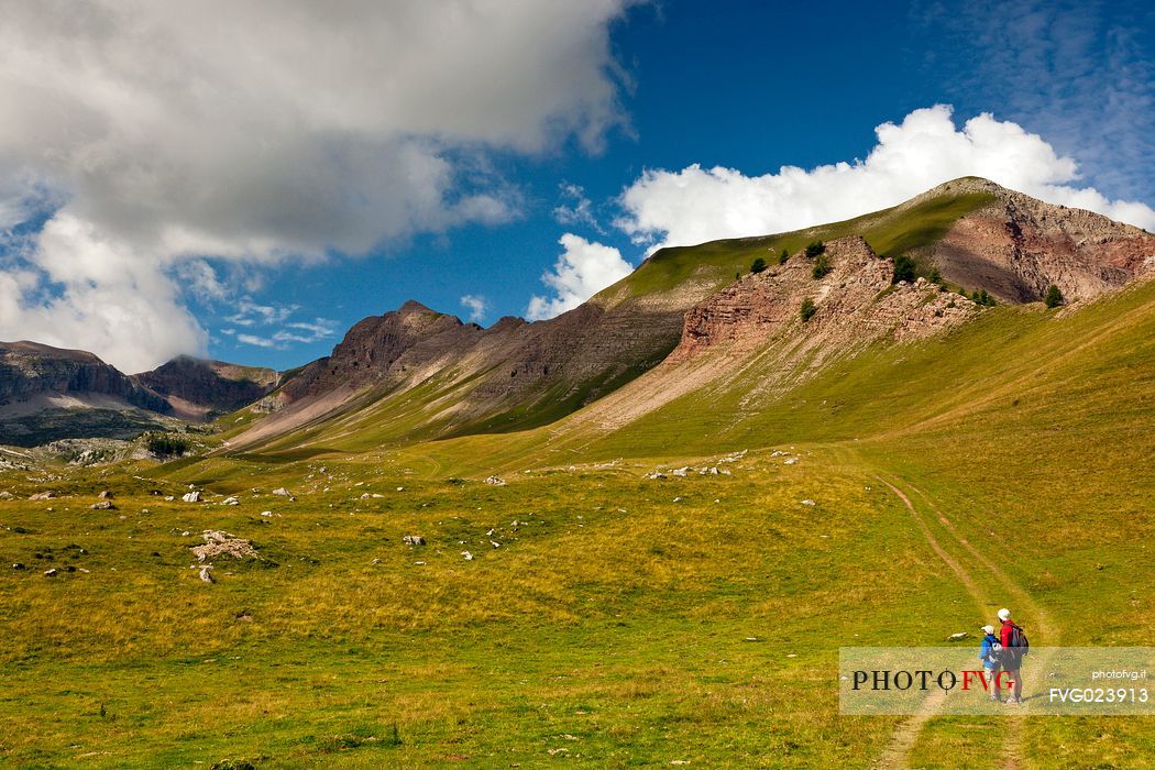 Hikers in the solitary Pian della Nana, Brenta dolomites, Trentino, Italy