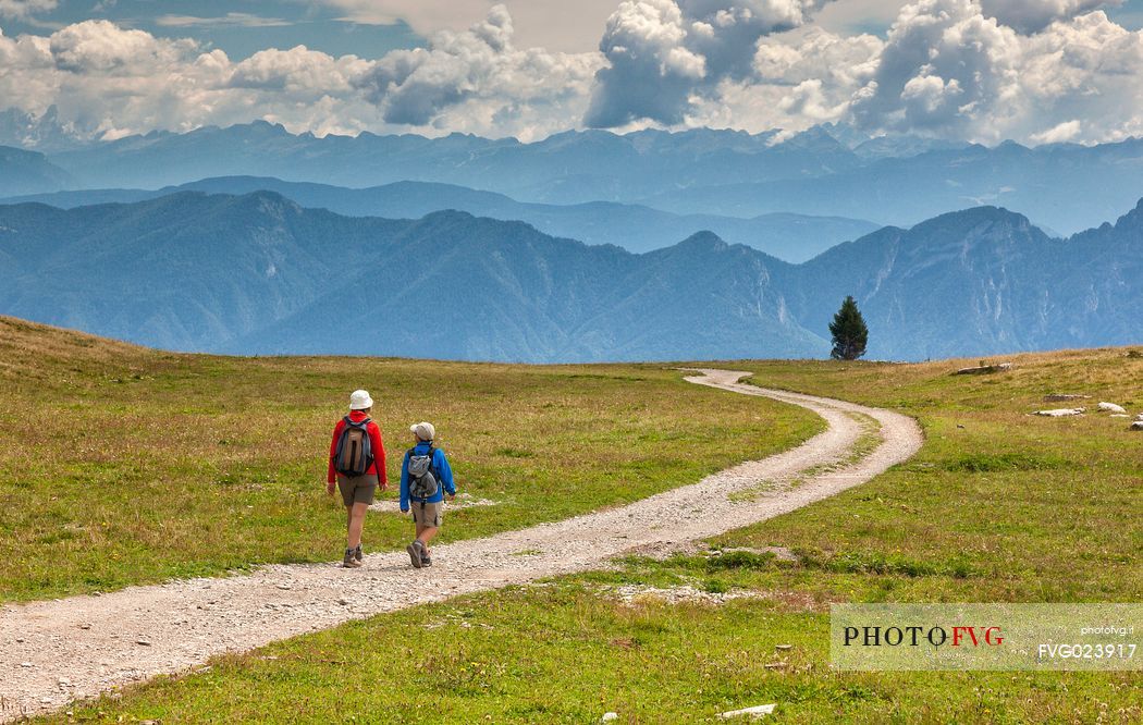 Hikers in the solitary Pian della Nana, Brenta dolomites, Trentino, Italy