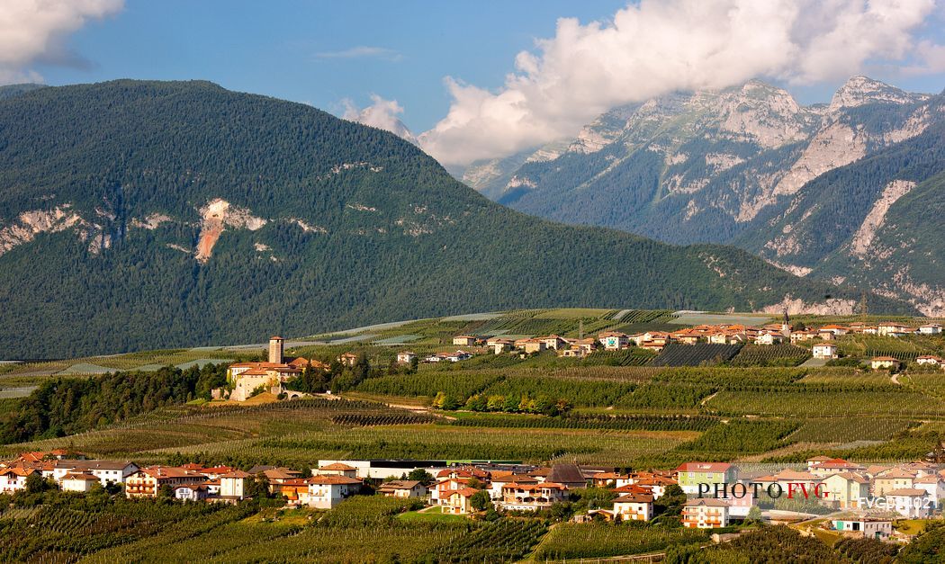 Castel Valer castle and the village in the apple trees valley, Val di Non, Trentino, Italy