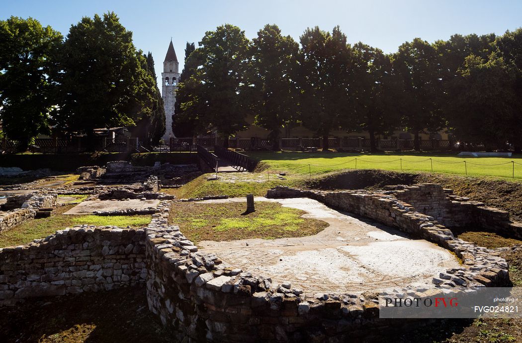 Archaeological area of Aquileia and in background the Basillica's bell tower, Italy