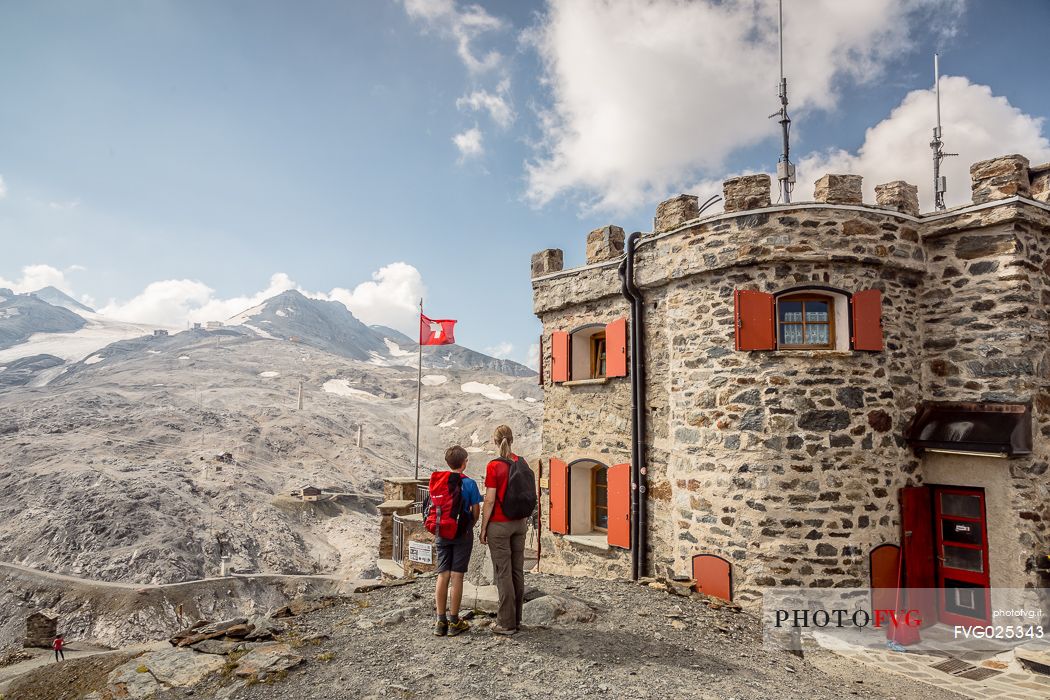 Hikers at Garibaldi hut or Dreisprachenspitze, Stelvio pass, Stelvio national park, Italy