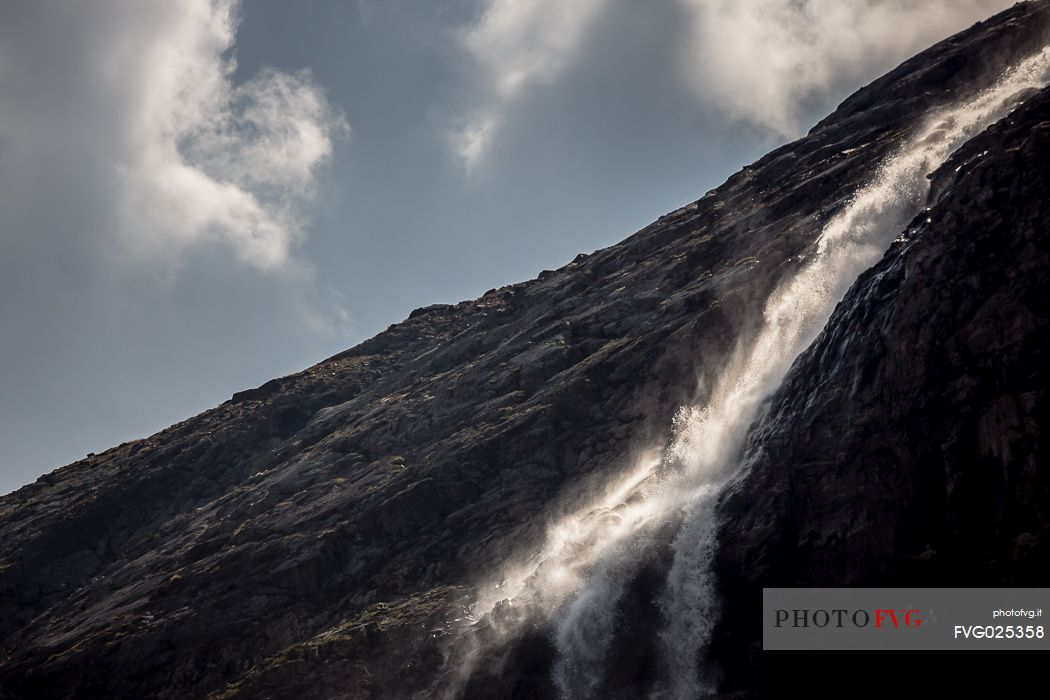 Waterfall in Martello valley along the glacial path , Stelvio national park, Italy