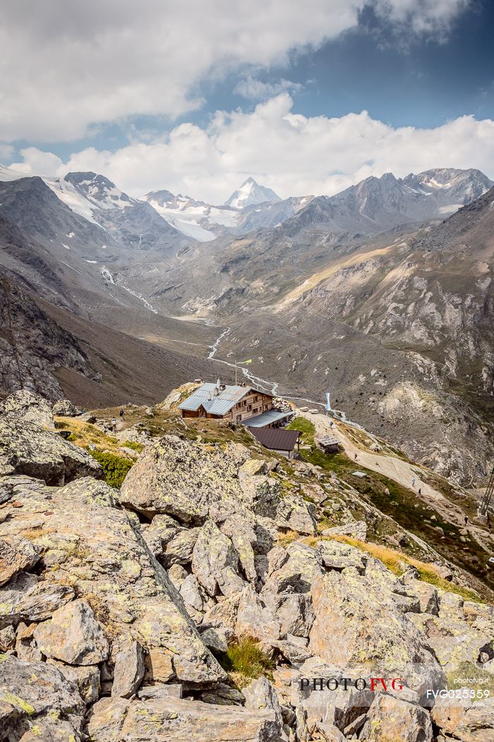 Martello hut and in the background the glacier of Cevedale mount and Gran Zebr peak, Stelvio national park, Italy