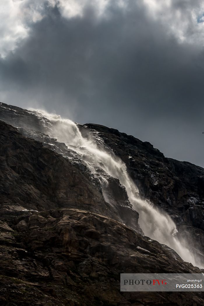 Waterfall in Martello valley along the glacial path , Stelvio national park, Italy