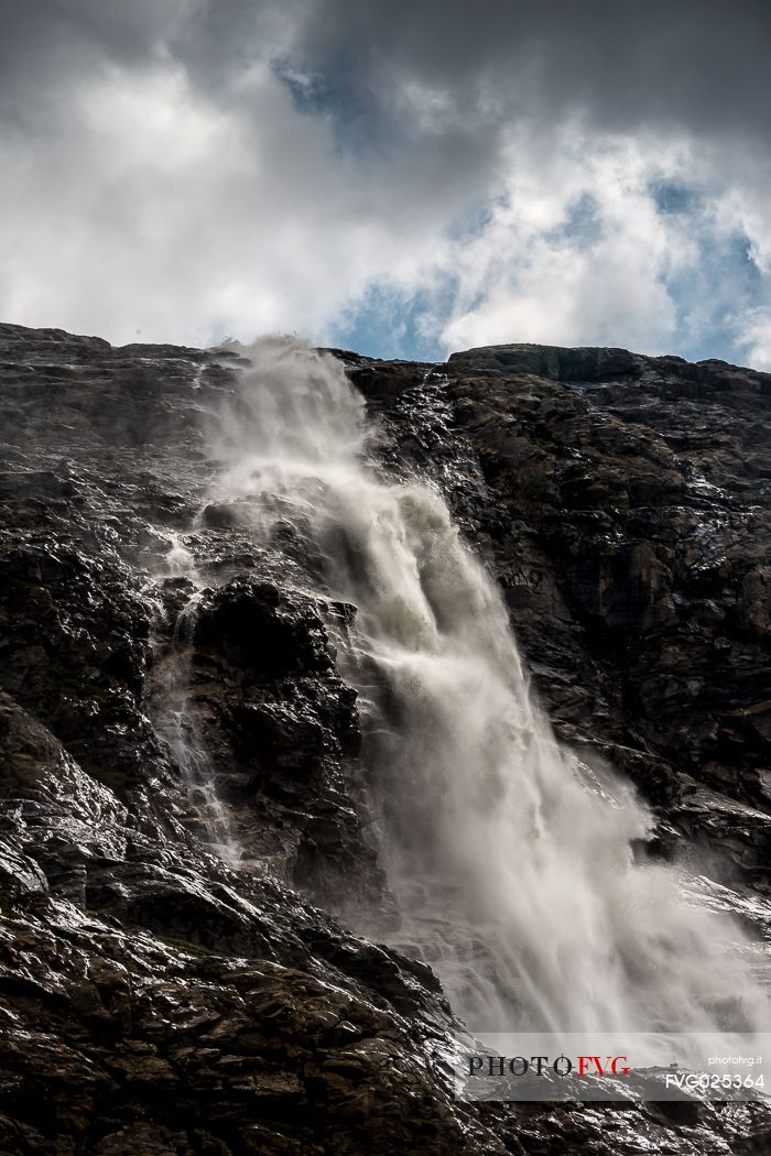 Waterfall in Martello valley along the glacial path , Stelvio national park, Italy