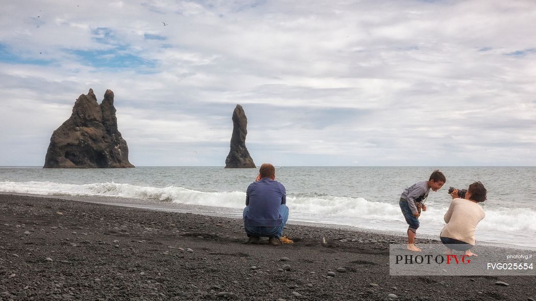 Family at Reynisdrangar Basalt Rocks on Cape Dyrholaey, Vik i Myrdal, Iceland