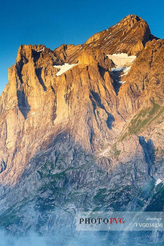 Sunset on Jungfrau mountain group from Grindelwald village, Berner Oberland, Switzerland, Europe