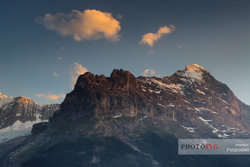 Sunset on Eiger and Fiescherhorn mountain in the Jungfrau mountain group from Grindelwald village, Berner Oberland, Switzerland, Europe