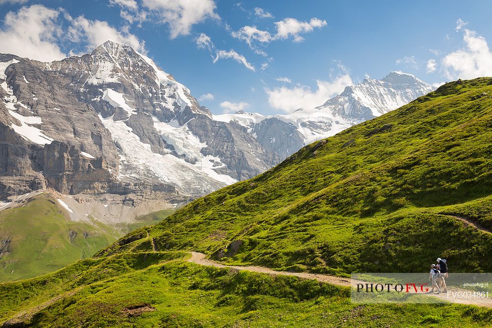 Mother and child in the path from Mannlichen to Kleine Scheidegg, in the background the Jungfrau mountain group, Grindelwald, Berner Oberland, Switzerland, Europe
 