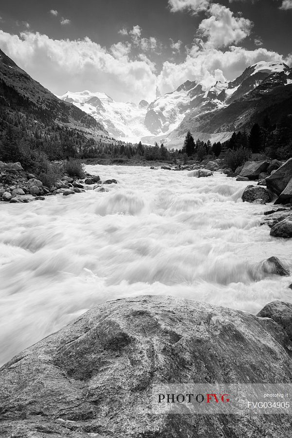 Wild creek in Val Morteratsch valley with Morteratsch Glacier and Bernina mountain group, Engadin, Pontresina, Graubunden, Switzerland, Europe
 