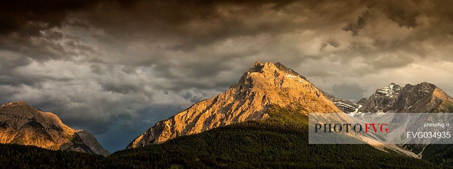 The mountains of national park swiss at sunset next to Scuol, low engadin, canton of Grisons, Switzerland, Europe