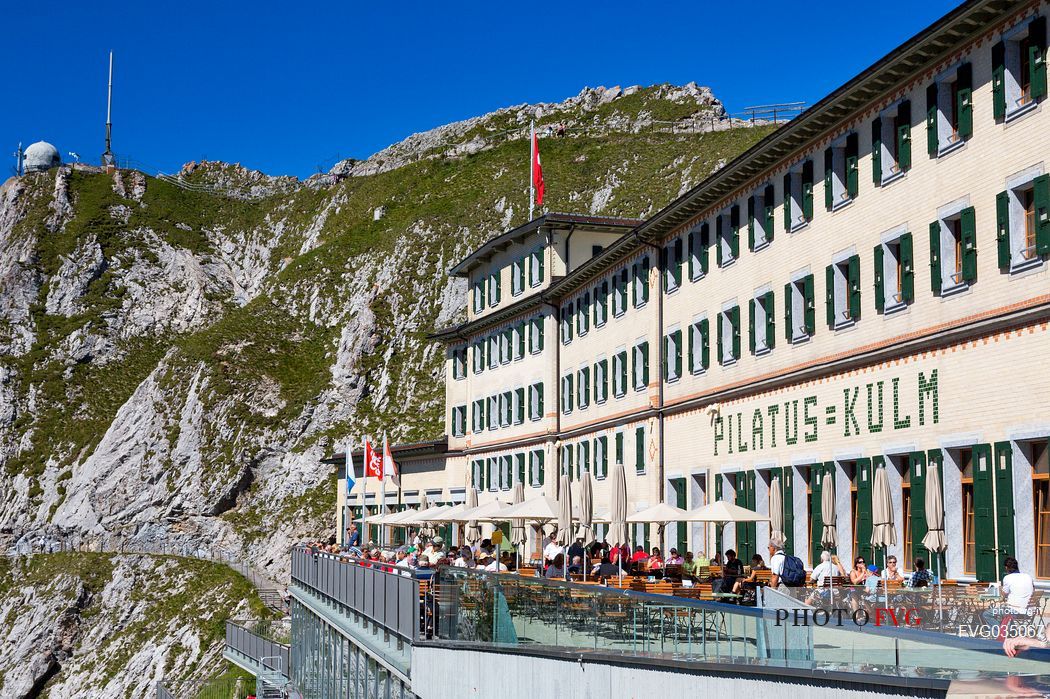 Tourists on the terrace of Pilatus Klum hotel on Pilatus mountain top, Lucerne, Border Area between the Cantons of Lucerne, Nidwalden and Obwalden, Switzerland, Europe