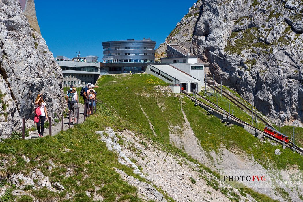 The red Cogwheel Railway arriving at the Pilatus Mountain station, Border Area between the Cantons of Lucerne, Nidwalden and Obwalden, Switzerland, Europe