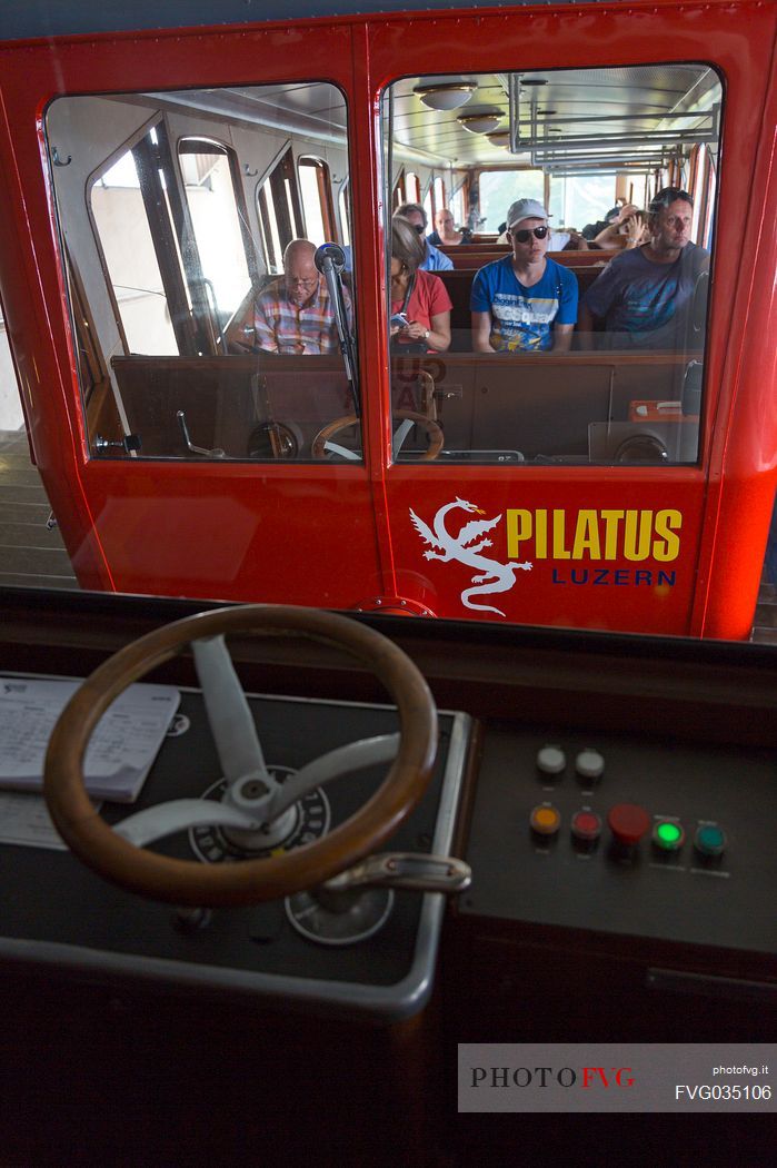 Tourists inside the Cogwheel Railway going up Pilatus Mountain, Border Area between the Cantons of Lucerne, Nidwalden and Obwalden, Switzerland, Europe