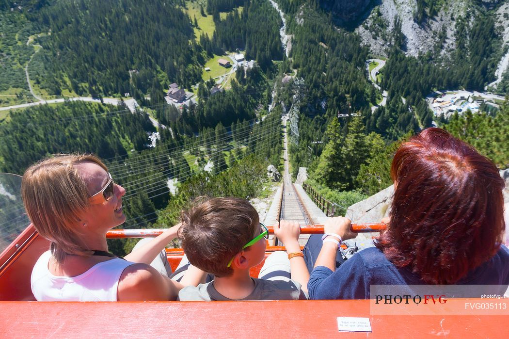 Tourists come down with the Gelmerbahn funicular, the steepest in the world, Canton of Bern, Switzerland, Europe
