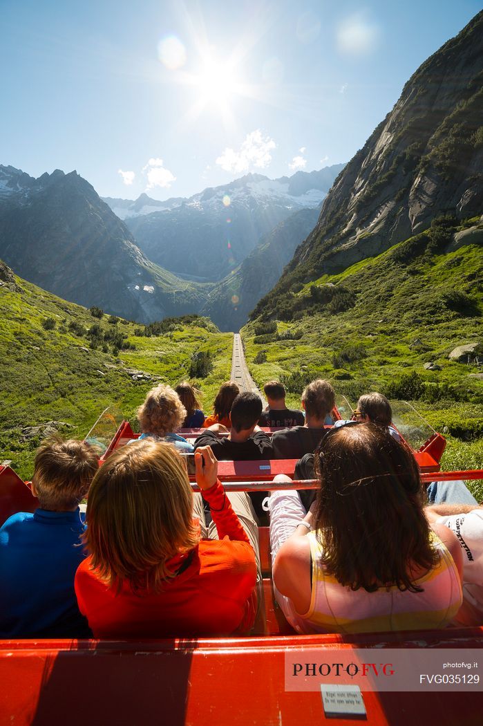 Tourists come down with the Gelmerbahn funicular, the steepest in the world, Canton of Bern, Switzerland, Europe
