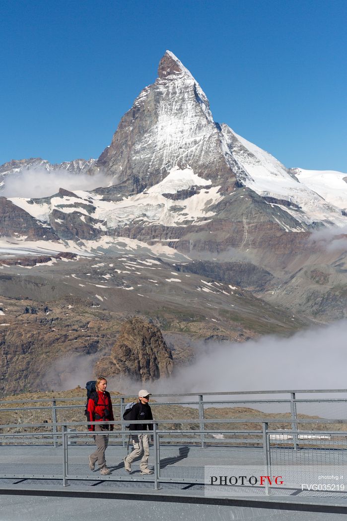 Hikers at the Gornergrat, in the background the Matterhorn or Cervino mount, Zermatt, Valais, Switzerland, Europe
