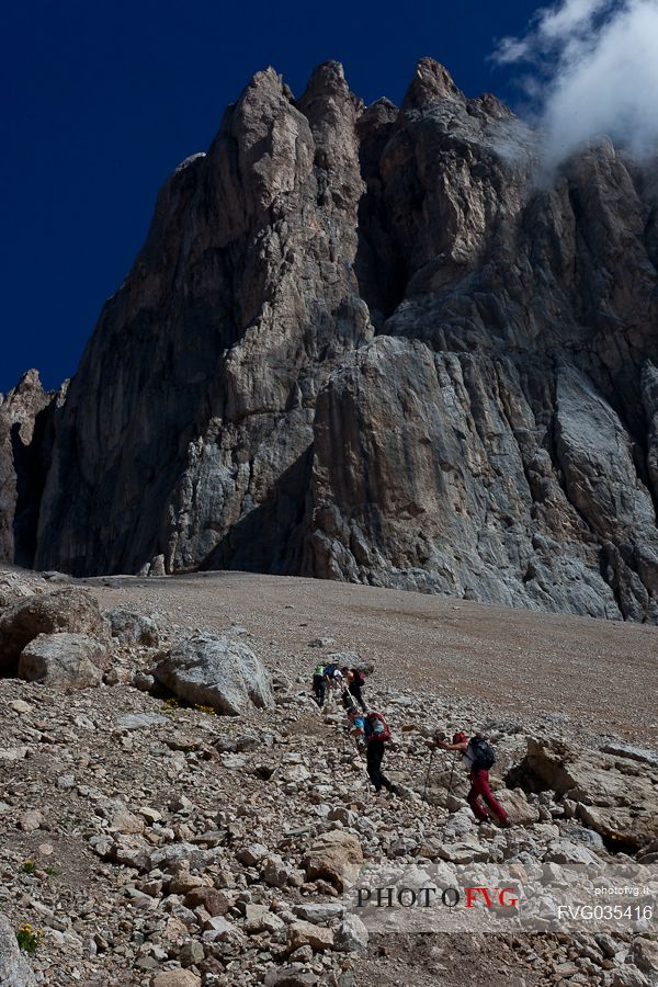 Hikers in the Marmolada mountain range, Ombretta valley, dolomites, Veneto, Italy, Europe