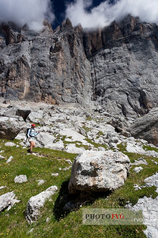 Hiker in the Marmolada mountain range, Ombretta valley, dolomites, Veneto, Italy, Europe