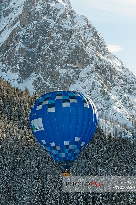 Hot air balloon flying over the Sexten dolomites during the balloon festival of Dobbiaco, Pusteria valley, dolomites, Trentino Alto Adige, Italy, Europe