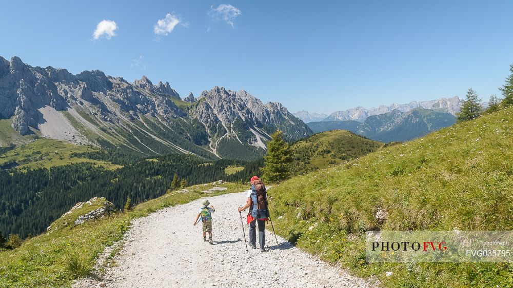 Family near the source of the Piave river, Sappada, dolomites, Friuli Venezia Giulia, Italy, Europe