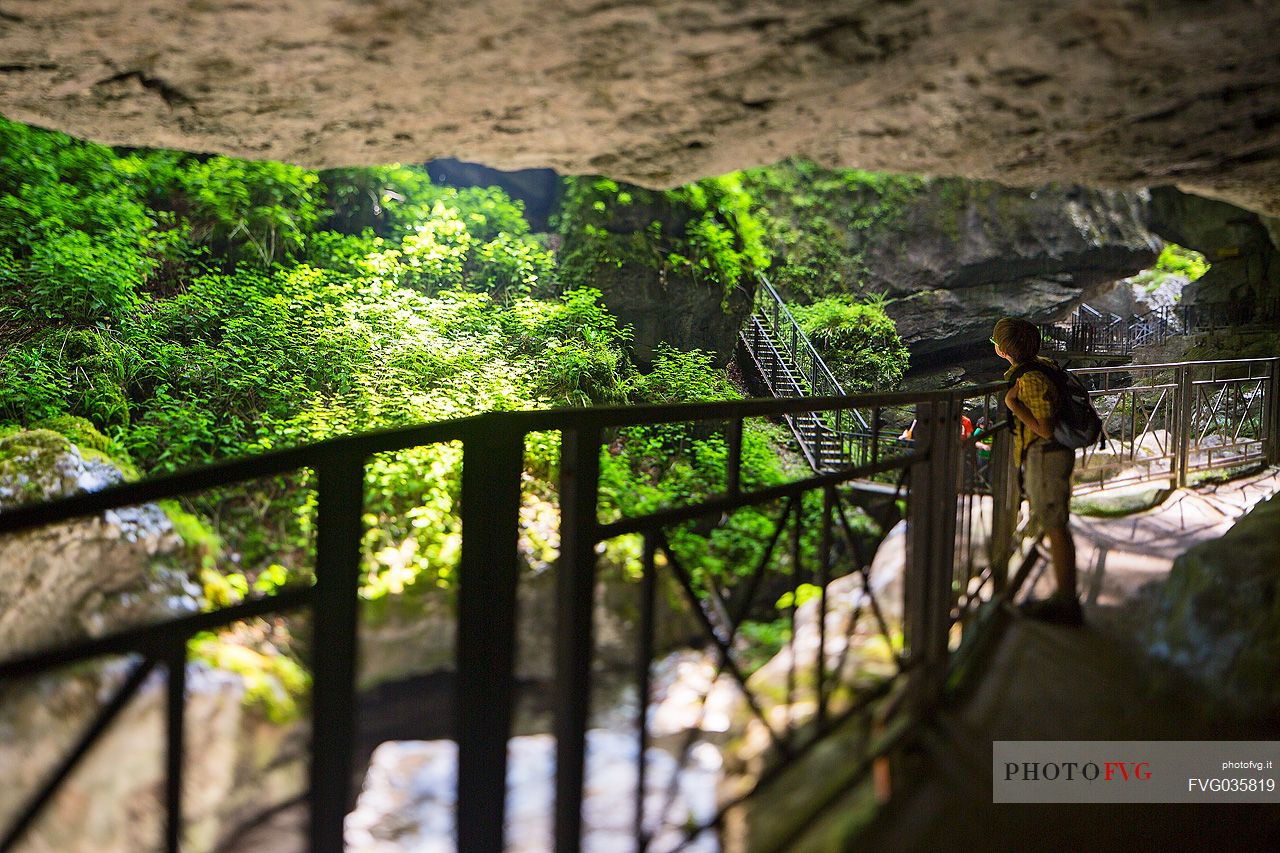 Child visiting the Pradis Caves, Clauzetto, Friuli Venezia Giulia, Italy, Europe