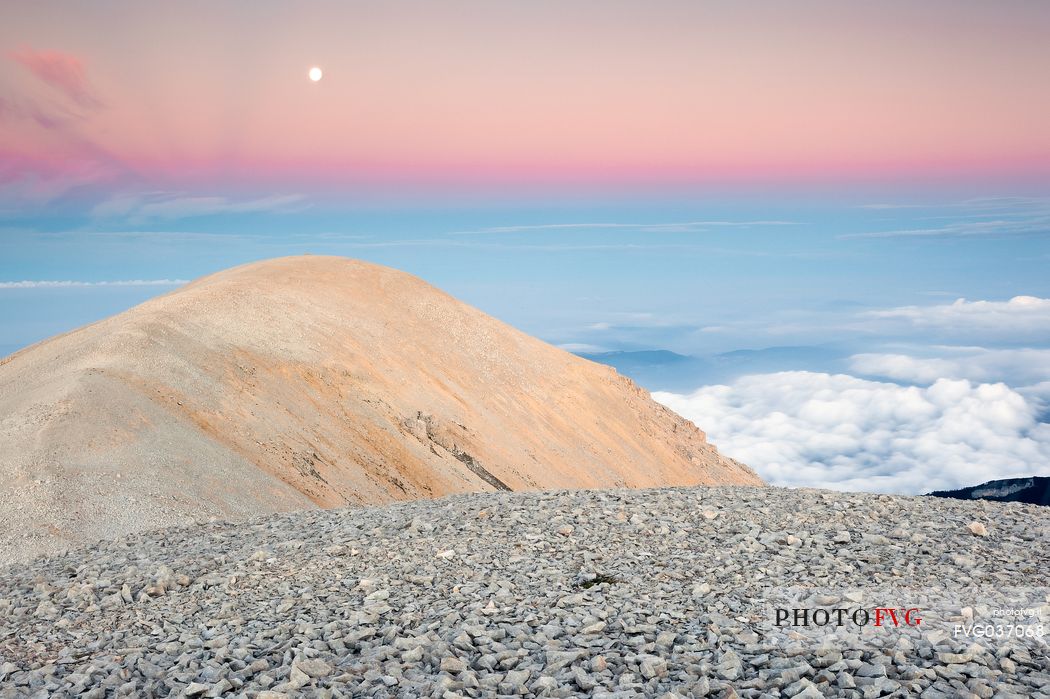 The moon rise over the Mount Acquaviva in the amphitheater of the Murelle, Majella national park, Abruzzo, Italy, Europe